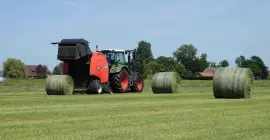 A view of a VB 3160 ejecting a bale from behind the machine