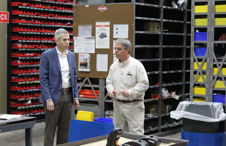 Representative Brindisi walks the warehouse with Jerry Smith.