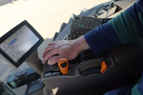 Hand-on-tractor-control.jpg