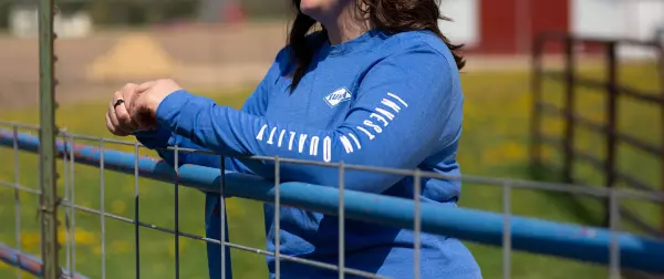 Woman wearing Kuhn long-sleeve t-shirt.
