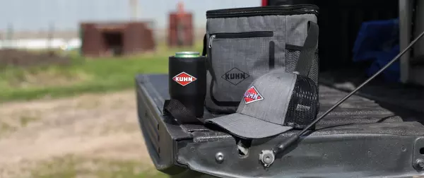 KUHN cooler, hat and tumbler on truck tailgate 