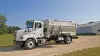 BTC 155 truck-mounted delivery box parked in gravel driveway.