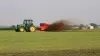 Side view of a SL 124 spreading liquid slurry in a field.